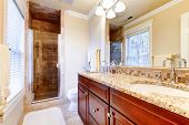pic of interior  - Large bathroom interior with cherry cabinets and granite countertop - JPG 