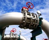 stock photo of industrial  - Industrial zone Steel pipelines and valves against blue sky - JPG 