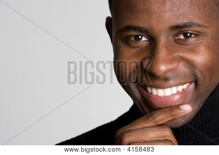 Picture or Photo of Handsome young black man smiling into camera