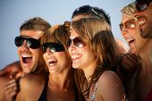 image of blue sky  - Portrait of a group of friends at the beach - JPG 