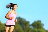 image of aspiration  - Happy woman running in city park - JPG 