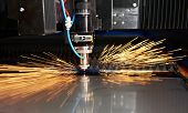 picture of industrial  - Industrial Laser cutting processing manufacture technology of flat sheet metal steel material with sparks - JPG 