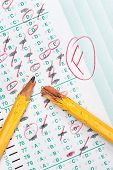 image of failure  - A graded test form with red scoring pencil marks indicates frustration and failure in the education system - JPG 