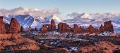 stock photo of sunset  - Turret Arch with Snow Mountains at sunset - JPG 