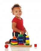 picture of toddlers  - An adorable toddler playing with a stacking toy - JPG 