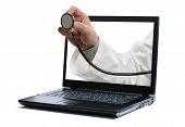 pic of medical doctors  - Doctors hand holding a stethoscope through a laptop screen towards a patient - JPG 