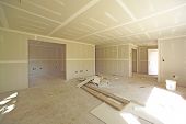 picture of construction  - Image of house under construction showing unfinished surfaces and drywall implementation - JPG 
