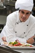 stock photo of restaurant  - Portrait of a male chef in the restaurant - JPG 