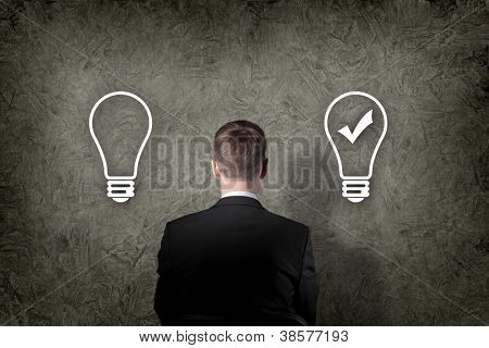 Picture or Photo of Senior businessman thinking and making choice while looking up