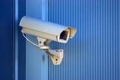 pic of security  - Security camera on the blue wall - JPG 