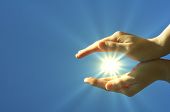 pic of religion  - hand sun and blue sky with copyspace showing freedom or solar power concept - JPG 