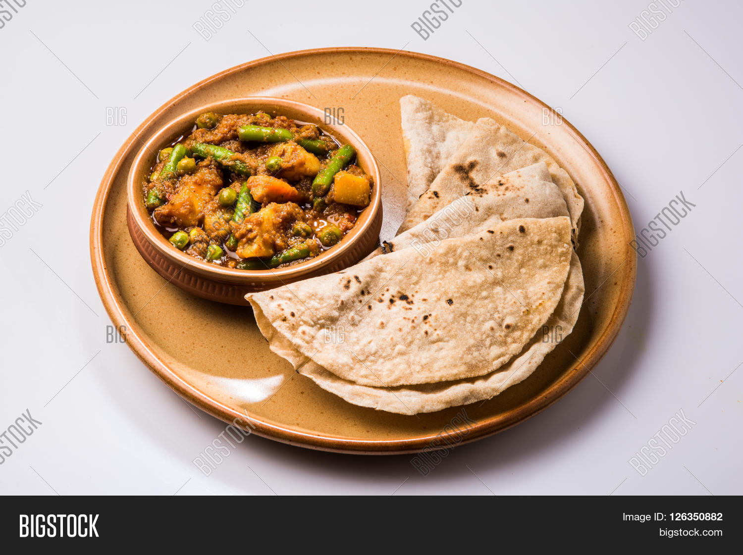 indian recipe, mixed veg containing potato and beans with traditional