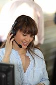 stock photo of telemarketing  - Portrait of a smiling telemarketer - JPG 
