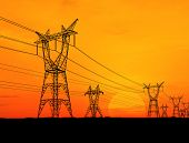 picture of sunset  - Electricity pylons and power lines at orange sunset - JPG 