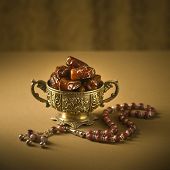 stock photo of religion  - Classic arabic teacups and dates - JPG 