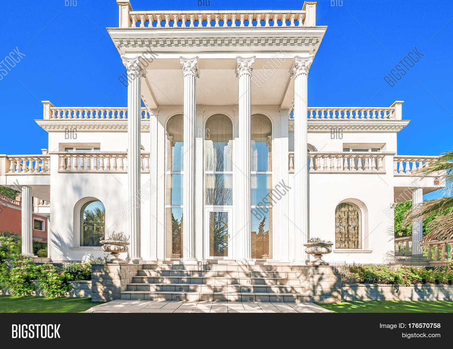 Classic Luxury House the facade of a luxurious residence with columns in the corinthian Classic Luxury House the facade of a luxurious residence with columns in the corinthian