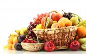 image of exotic  - Assortment of exotic fruits and berries in baskets isolated on white - JPG 