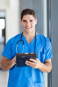 picture of medical doctors  - male medical doctor using tablet computer in hospital - JPG 