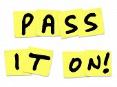 stock photo of informative  - The words Pass It On written on yellow sticky notes to illustrate a piece of news - JPG 
