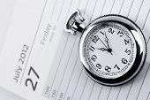 image of watch  - Pocket watch on diary page - JPG 