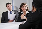 picture of business people  - Diverse business people conversing and negotiating focus on businesswoman 40s - JPG 