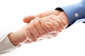 stock photo of handshake  - Image of partners handshake after signing contract - JPG 