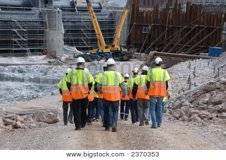 Picture or Photo of Construction workers going to work wearing helmets