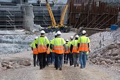 stock photo of construction  - Construction workers going to work wearing helmets - JPG 