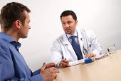 pic of medical doctors  - Two men discussing doctor and patient  - JPG 