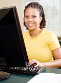 stock photo of computer  - mid age african american woman learning computer - JPG 