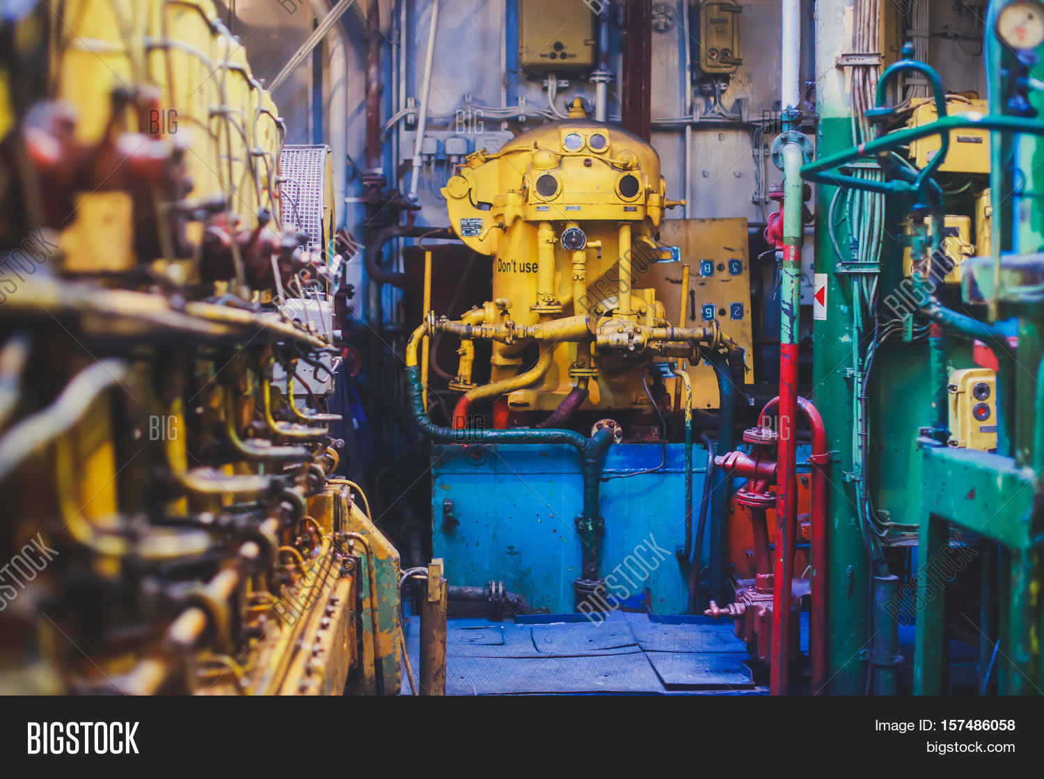 Engine Room on a cargo boat ship interior, ship's engine heavy