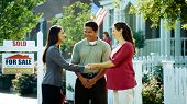 foto of home  - A young couple purchases a new home from a real estate agent - JPG 
