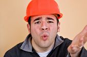 image of construction worker  - This construction worker is frustrated and confused about something - JPG 