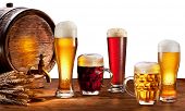 stock photo of objects  - Beer barrel with beer glasses on a wooden table - JPG 