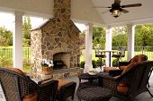 stock photo of outdoor  - Beautiful outdoor living space with fireplace and vaulted ceiling - JPG 