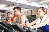 picture of fitness  - Happy people doing indoor biking in a fitness club - JPG 