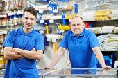 image of hardware  - two seller assistant men in DIY hardware or home improvement store supermarket - JPG 