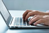 picture of laptop  - Closeup of businessman typing on laptop computer - JPG 