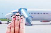 stock photo of member  - Human fingers gesturing as four family members going for a trip - JPG 