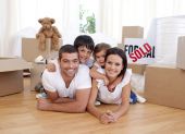 foto of family  - Happy family lying on floor after buying new house - JPG 