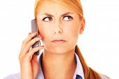 foto of worry  - A portrait of a worried woman talking on the phone - JPG 