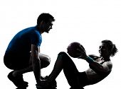 foto of fitness  - one caucasian couple man woman personal trainer coach exercising weights fitness ball silhouette studio isolated on white background - JPG 