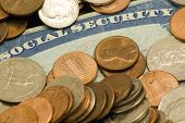 image of security  - Picture of social security card surrounded by old pennies nickels dimes quarters - JPG 
