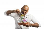 foto of money  - Concept of businessman that eats the money - JPG 
