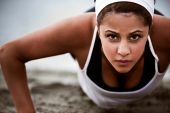 stock photo of fitness  - A beautiful asian woman doing push up at a beach - JPG 