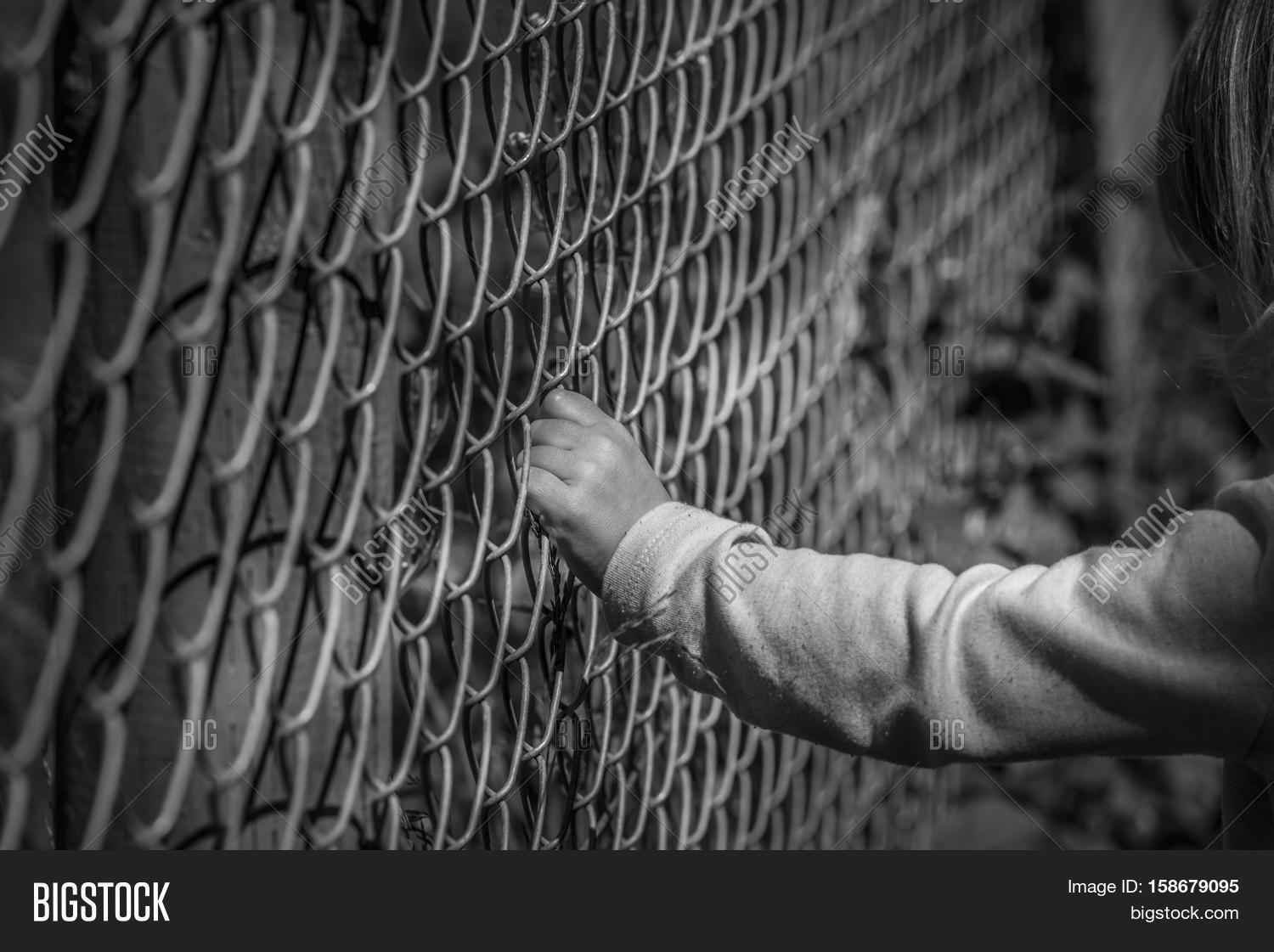 Little Girl Hand Holding Fence Image & Photo Bigstock