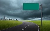 pic of road sign  - blank road sign with cityscape at far side - JPG 