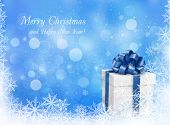 picture of illustration  - Christmas blue background with gift box and snowflake - JPG 