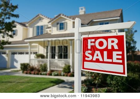 Picture or Photo of Home For Sale Real Estate Sign in Front of New House.