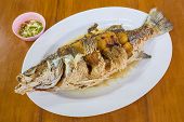 foto of seep  - Seep Fried sea bass with fish sauce serve with seafood sauce - JPG 